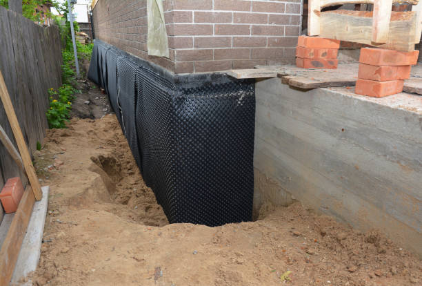 Happy homeowners after waterproofing job in South Hutchinson